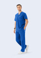 Royal Blue DynaComfort™ men's scrub top with matching scrub pants, walking view by COMENII