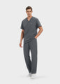 Graphite ProEase™ men's scrub top with matching scrub pants, full-length view by COMENII