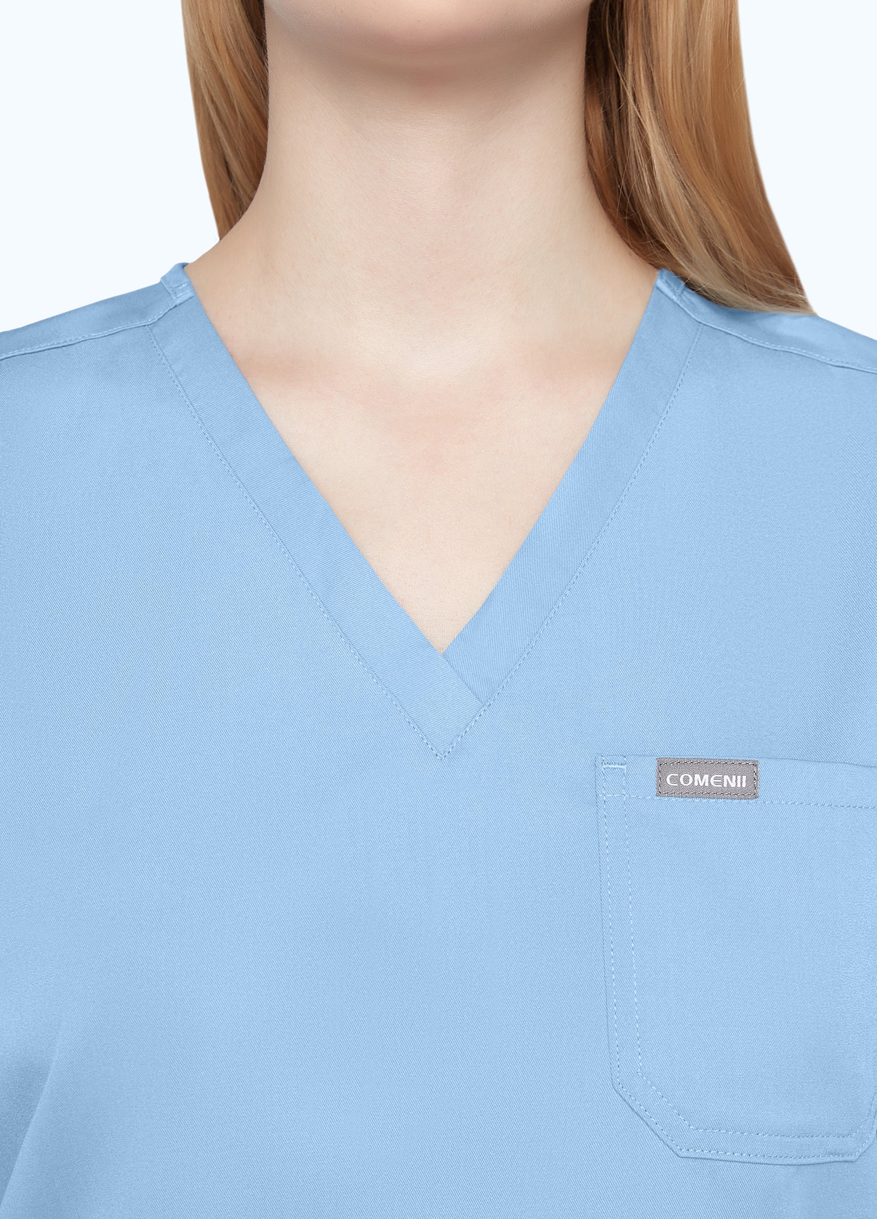 Blusa médica moderna con 1 bolsillo para mujer