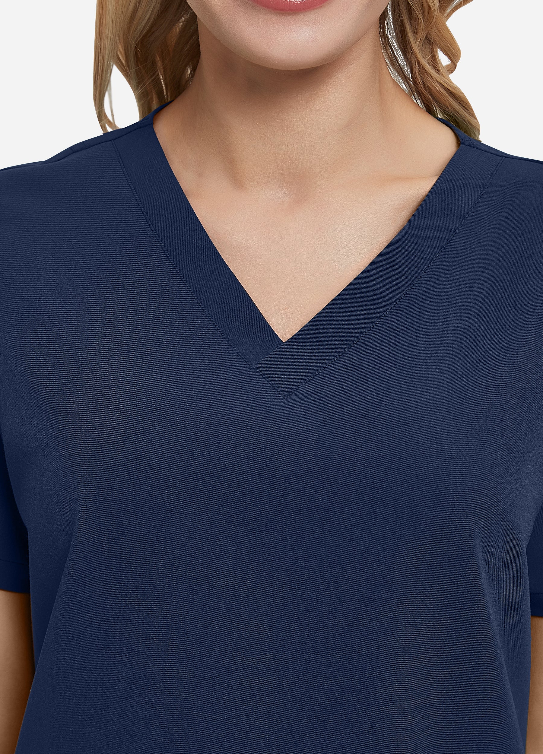 Blusa médica de 4 bolsillos con escote en V para mujer