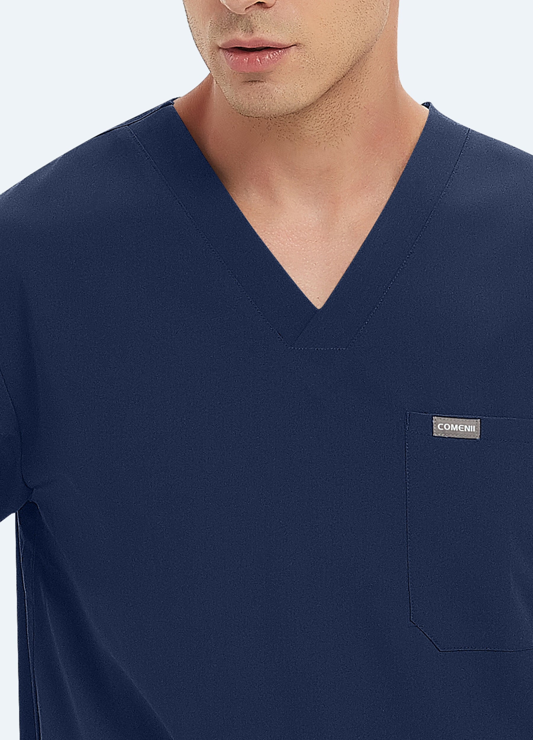 Blusa médica a medida con escote en V y 3 bolsillos para hombre