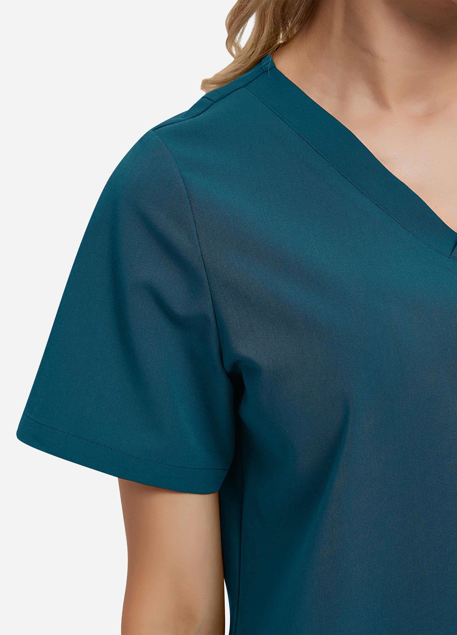 Blusa médica de 4 bolsillos con escote en V para mujer