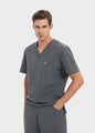 Graphite ProEase™ men's scrub top front three-quarter fit on model by COMENII
