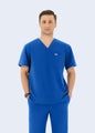 Royal Blue DynaComfort™ men's scrub top front view on model by COMENII
