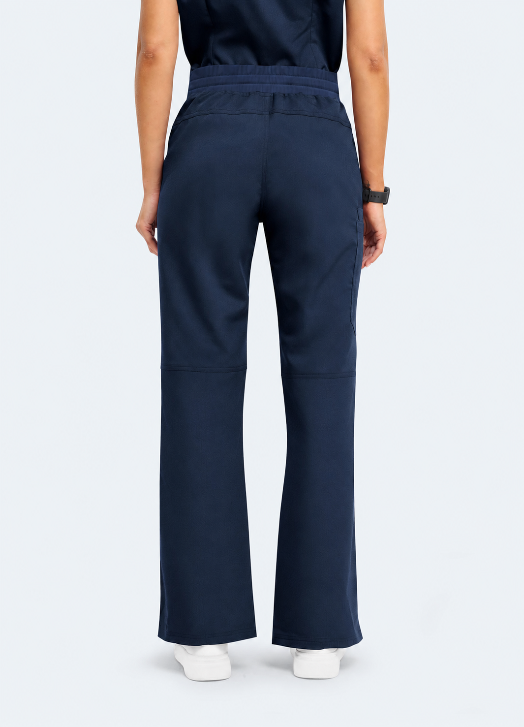 Midnight Navy StyleFlex™ Essential women's scrub pants on model, back view by COMENII